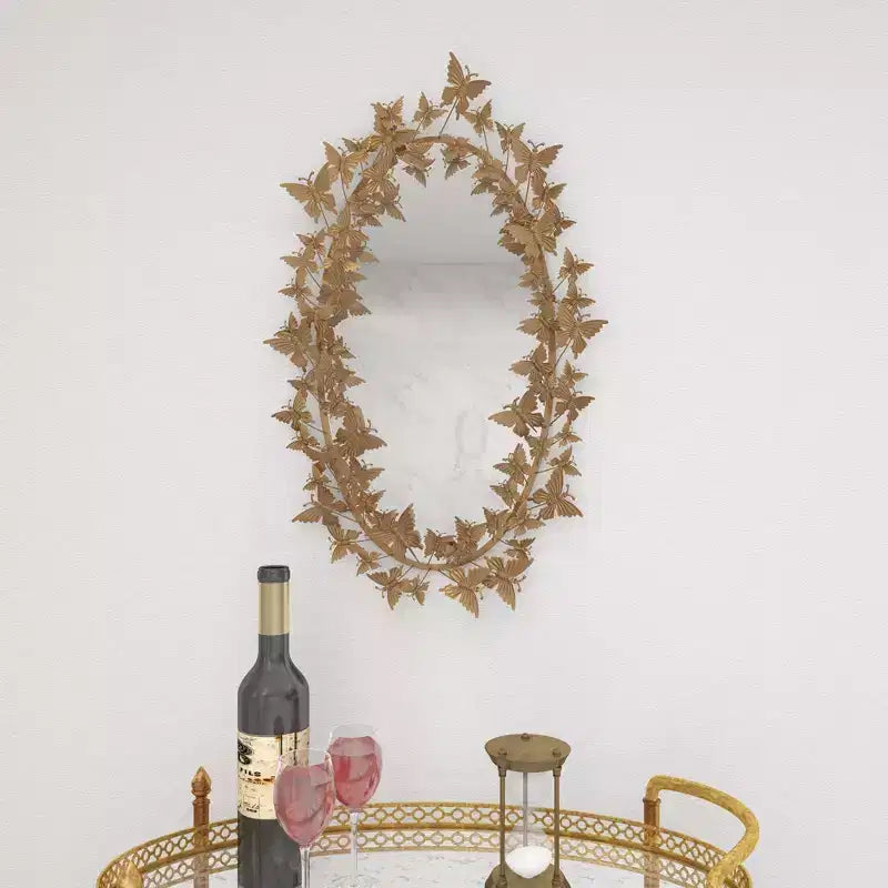 Specchio da parete farfalla Glam Metal oro - Olivia & May: Struttura in ferro, forma rotonda, nessun montaggio richiesto