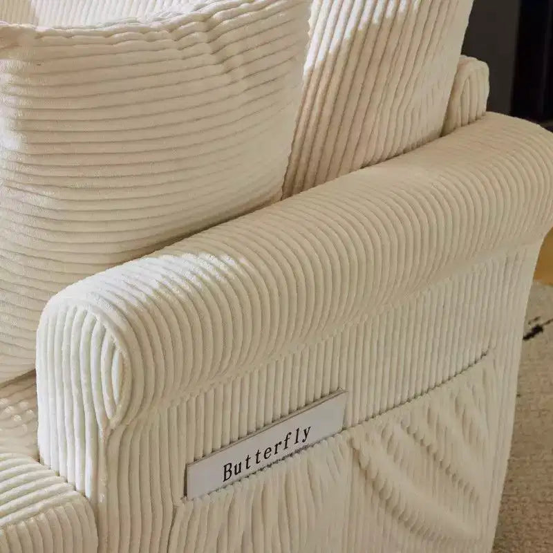 Poltrona accent girevole a barilotto Karl Home in velluto a coste beige per soggiorno