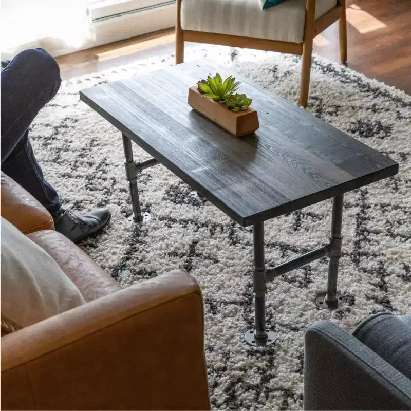 Tavolino RESTORE Boulder nero in legno massello di Pipe Decor