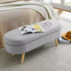 Banc de rangement ottoman Zeus et Ruta en tissu ovale avec pieds en bois d'hévéa