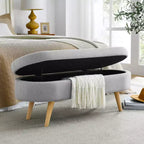 Banc de rangement ottoman Zeus et Ruta en tissu ovale avec pieds en bois d'hévéa