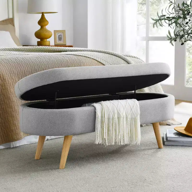 Banc de rangement ottoman Zeus et Ruta en tissu ovale avec pieds en bois d'hévéa