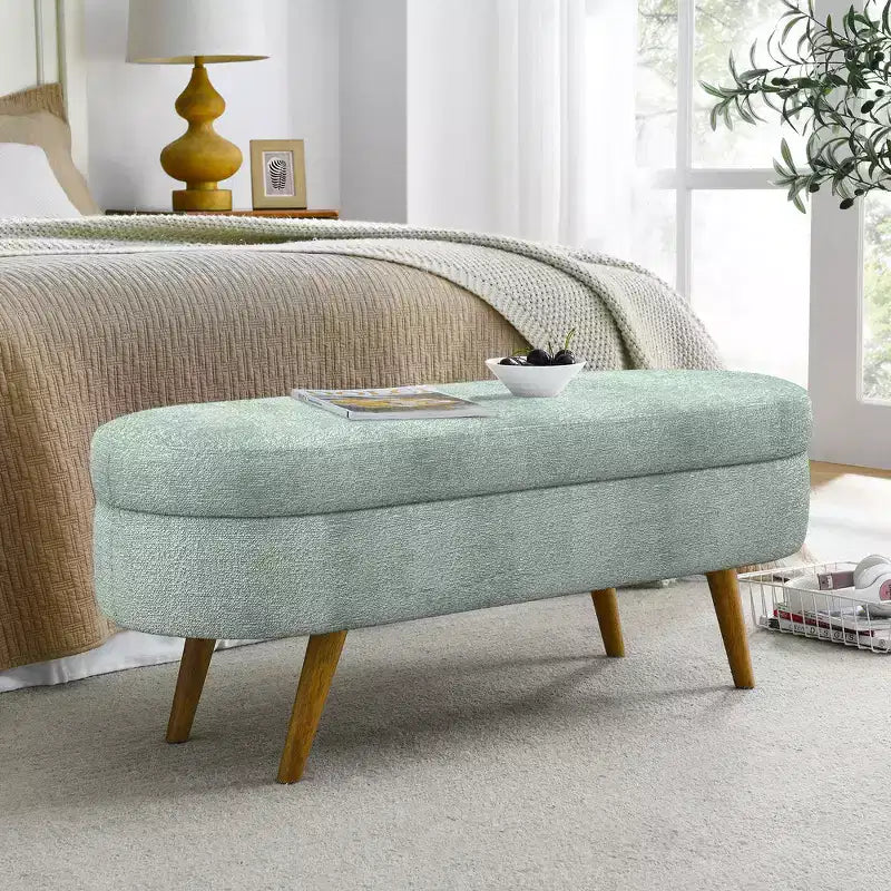 Banc de rangement ottoman Zeus et Ruta en tissu ovale avec pieds en bois d'hévéa