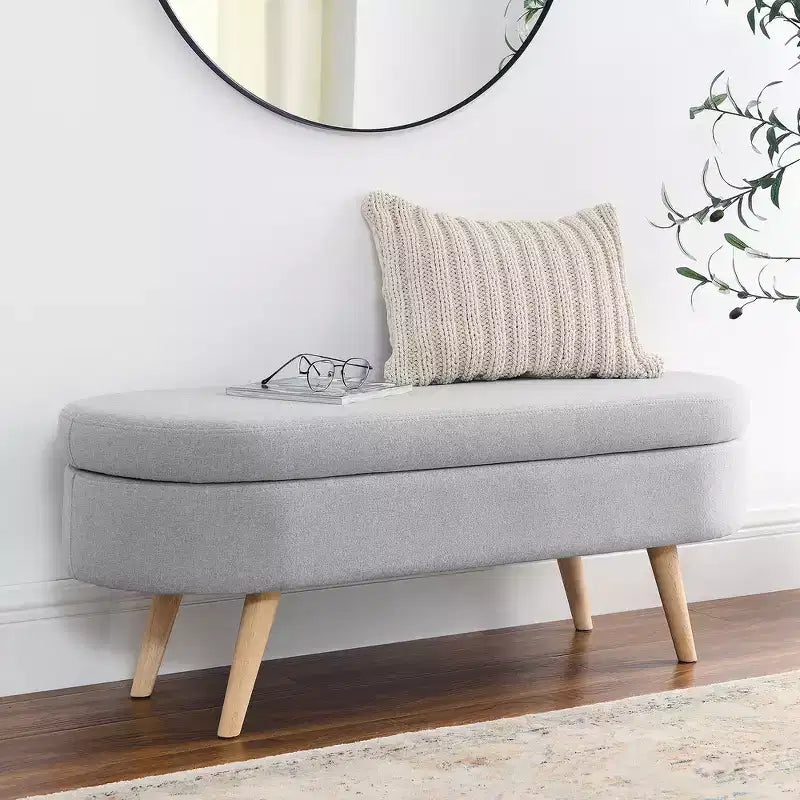Banc de rangement ottoman Zeus et Ruta en tissu ovale avec pieds en bois d'hévéa