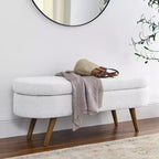 Banc de rangement ottoman Zeus et Ruta en tissu ovale avec pieds en bois d'hévéa