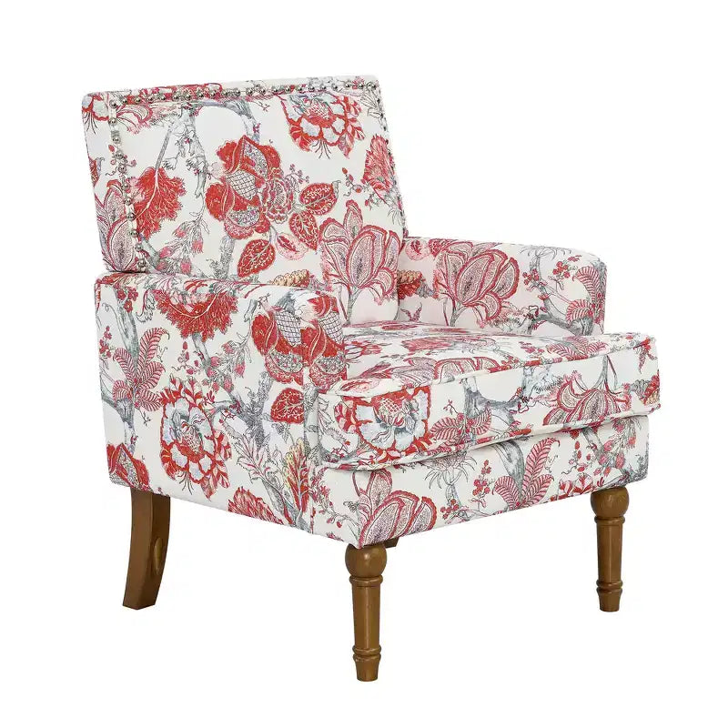 Poltrona di design Zeus & Ruta con rivestimento floreale, borchie e gambe in legno massello