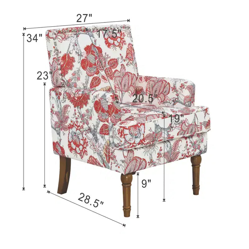 Poltrona di design Zeus & Ruta con rivestimento floreale, borchie e gambe in legno massello