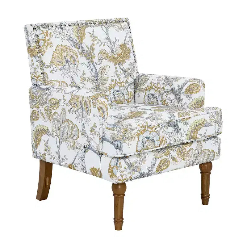 Poltrona di design Zeus & Ruta con rivestimento floreale, borchie e gambe in legno massello