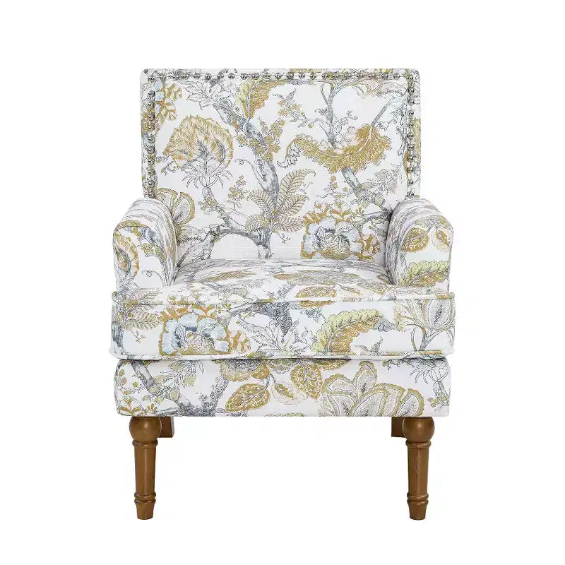 Poltrona di design Zeus & Ruta con rivestimento floreale, borchie e gambe in legno massello