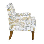 Poltrona di design Zeus & Ruta con rivestimento floreale, borchie e gambe in legno massello
