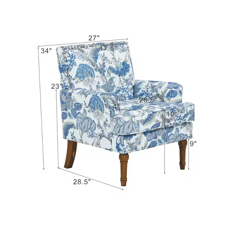 Poltrona di design Zeus & Ruta con rivestimento floreale, borchie e gambe in legno massello