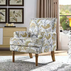 Poltrona di design Zeus & Ruta con rivestimento floreale, borchie e gambe in legno massello