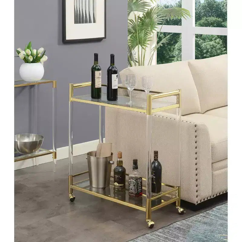 Carrello Bar in Acrilico e Vetro a 2 Ripiani Royal Crest Oro/Vetro - Breighton Home: Ripiani in Vetro Temperato, Ruote Girevoli
