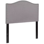 Testata imbottita ad arco Lexington di Flash Furniture con profili a borchie