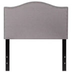 Testata imbottita ad arco Lexington di Flash Furniture con profili a borchie