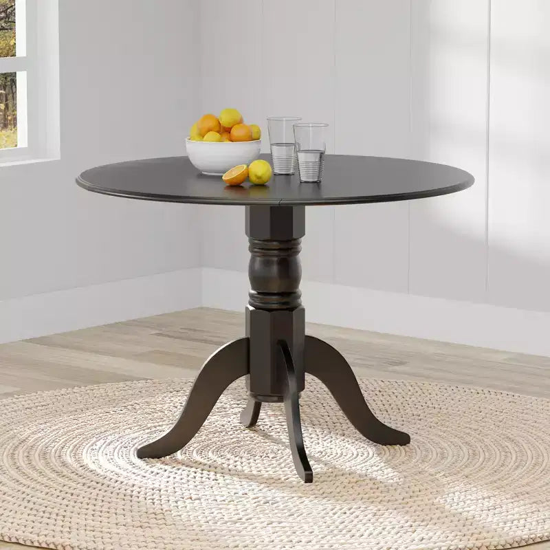 Tavolo da pranzo doppio a ribalta Glenwillow Home 42 con base a piedistallo in legno massello